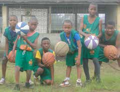 Children in Africa post with basketballs