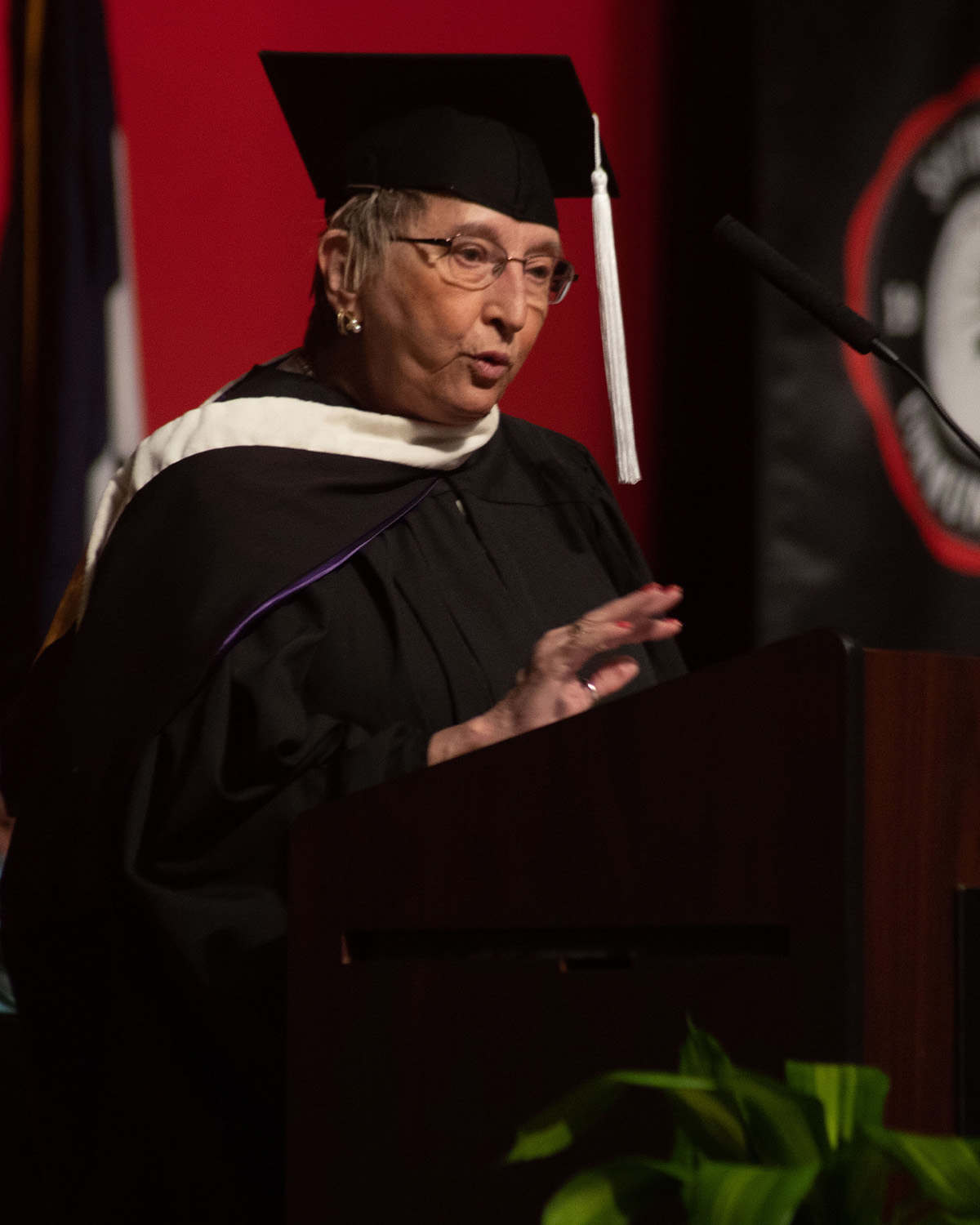 Women presenting at commencement ceremony